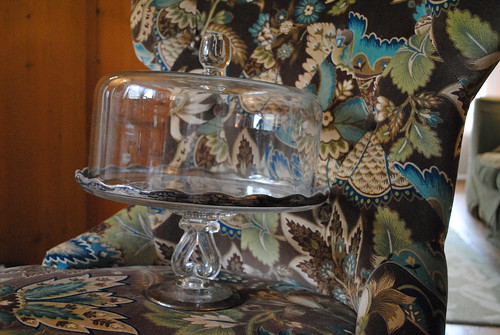 glass cake stand on chair