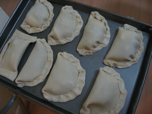 Empanadas on baking sheet