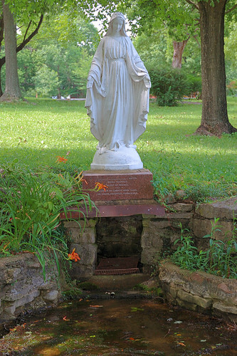 Sainte Marie du Lac Roman Catholic Church, in Ironton, Missouri, USA - statue of the Blessed Virgin Mary above spring source