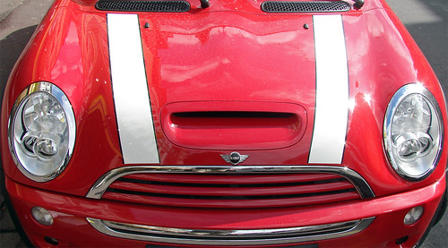 red austin mini cooper with white stripes