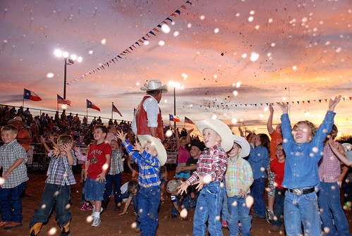 A Moment in Time Cowpoke Children Rodeo Bowie Texas Sunset Sky Cowboy Hats Blue Jeans Boots Smiles Flags