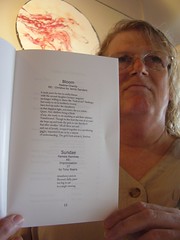 Pamela Raintree holds the chapbook "Standing at the Edge"