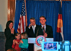 Michael Bennet with family and, behind him, Governor Ritter. (Image used under CC license from Jeffrey Beall)