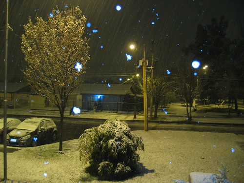Snowy scene of nighttime street
