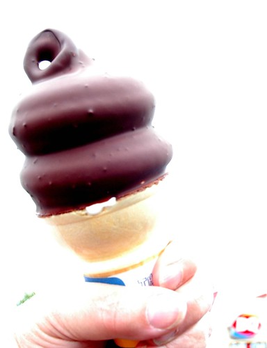 Chocolate dipped vanilla ice cream cone, swirl, hand held, Dairy Queen, Factoria, Washington, USA by Wonderlane