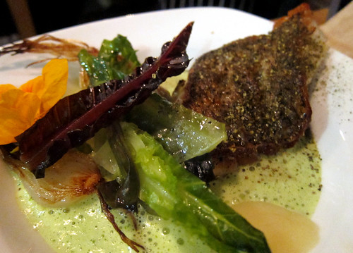 Black Sea Bass with fresh Sancho Pepper, Fresh Peas, Lettuce, Spring Onions and Yuzu