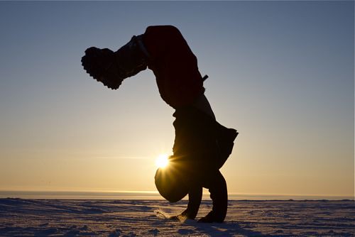 Arctic acrobat. Backflip, midnight sun, up near the magnetic North Pole