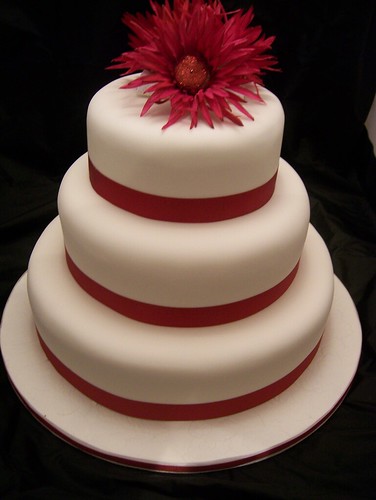 Gerbera Wedding Cake I love this cake It has silk flowers on top with 