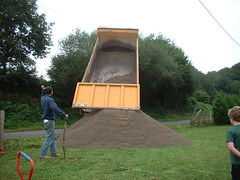 'Small' lorry delivering sand