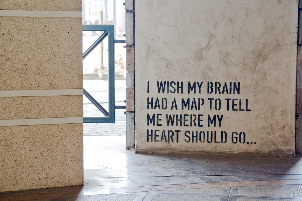 stencilled graffiti on concrete: I wish my brain had a map to tell me where my heart should go...