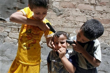 Iraqi kids taken by the way of the gun