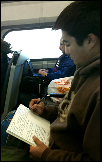 train-man-writing