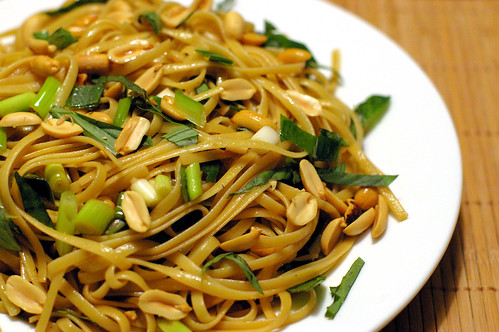Spicy Sesame Noodle with chopped nuts and Thai Basil