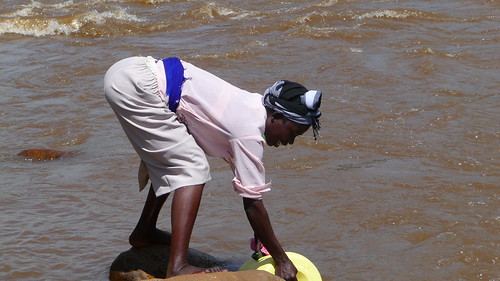 Day 6: Jennifer fills up a jerry can at the Mara River