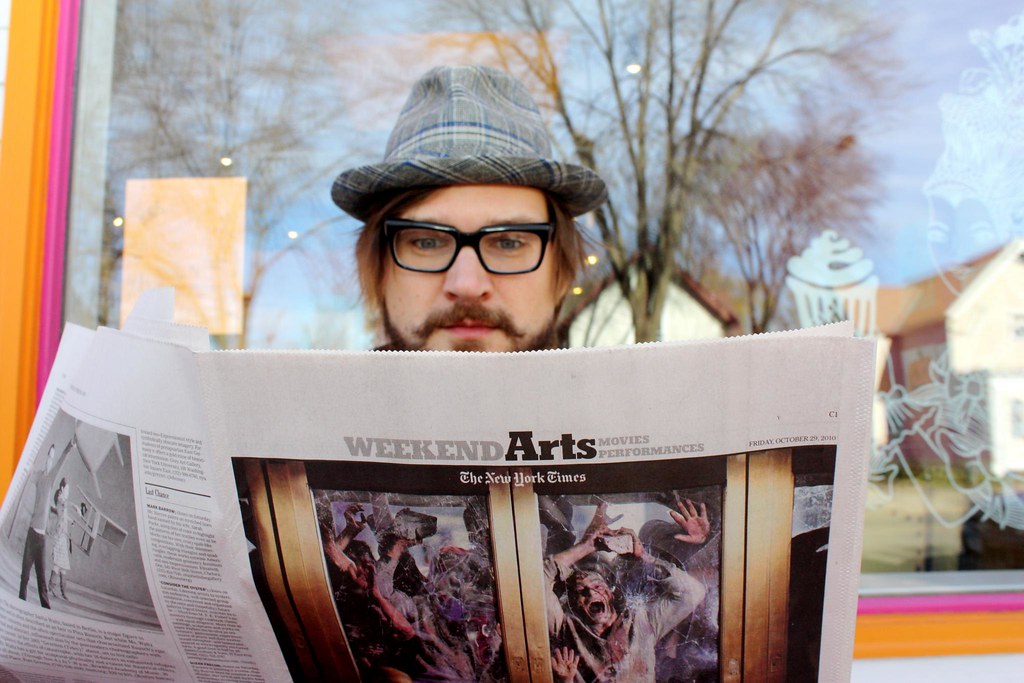 Dan reading the NY Times Weekend Arts section, with zombies?