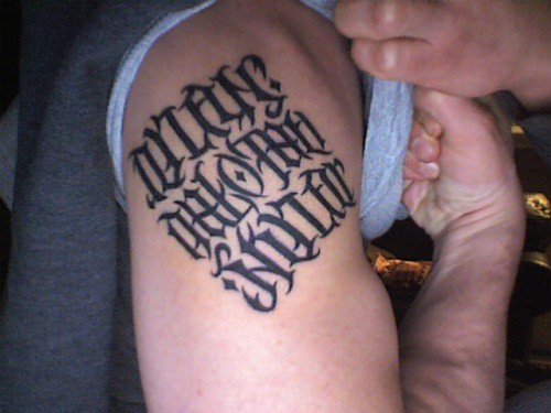 This ambigram as a finished tattoo! The names read the same when flipped 