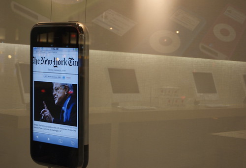 big iPhone in Apple store window displaying New York Times