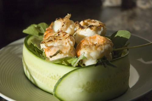 grilled rosemary shrimp with arugula in a cucumber bowl