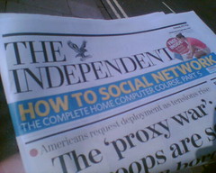 Newspaper with headlines "How to Social Network"