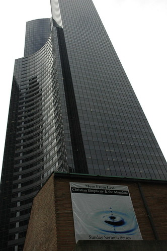 'More from Less, Christian Simplicity and the Abundant' poster below Columbia Tower Center, 5th Ave, Seattle, Washington, USA