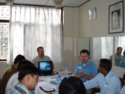 Patrick leading the Nepalese brothers through the CSC PowerPoint presentation