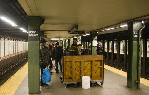 Guy playing the piano on a NYC subway platform; Union Square, 14th Street