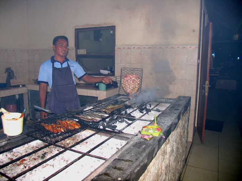 Cooking fresh seafood at Cafe Ayodya, Jimbaran