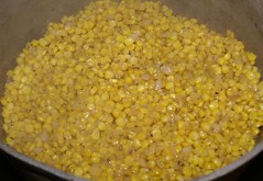 2.)  cook over high heat 15 minutes or so, until corn begins to release starch