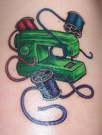 sewing machine tattoo. my right shoulder, about 6.5" high.