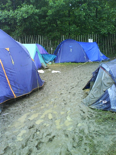 A river of mud slips gently by our tent