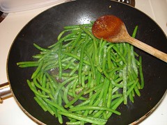 Green beans being stir fried