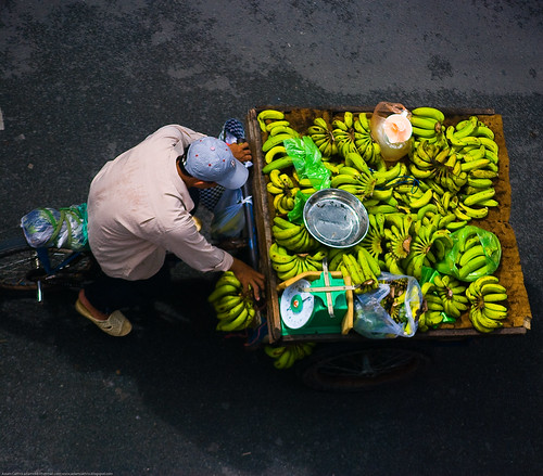 Man on a bike selling bananas, Saigon