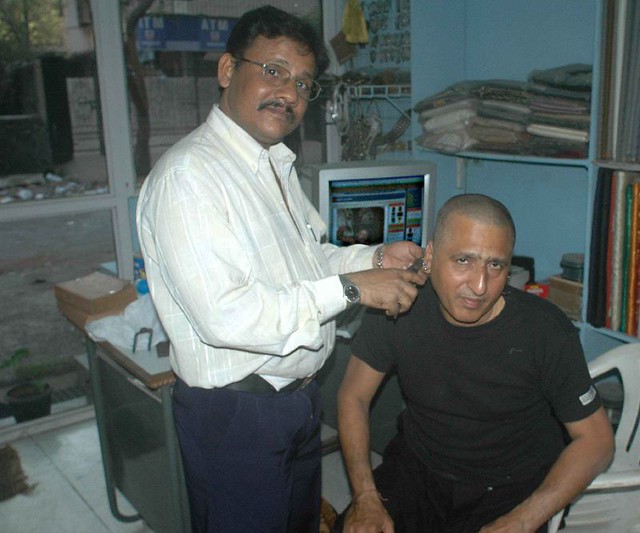Ear Piercing the Indian Way. This is Azad Hussain my silve smith , he burns 