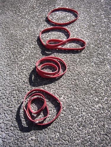 Kirsty Hall, photograph of red rubber bands