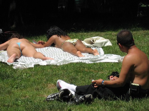 Ladies are sunbathing.. but what about the man?