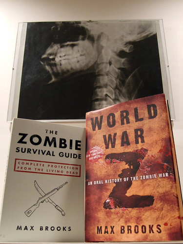 Zombie Survival Guide and World War Z, by Max Brooks. And a skull