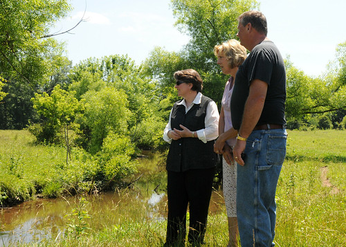 Agriculture Deputy Secretary Kathleen Merrigan looks over the creek at the farm of Mrs. Eby-Patterson and husband, Daniel. They are using new sustainable conservation techniques to keep their creek clean and to help improve the health of the Chesapeake Bay on their farm in Hershey, PA, on Friday, June 18, 2010.
