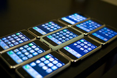 A line up of nine iPhones
