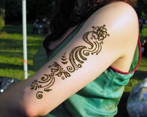 Henna tattoo on upper arm. Henna tattoo on upper arm