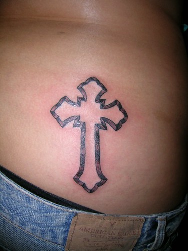 Tupac's cross tattoo on lower back girls
