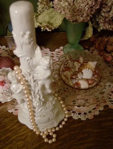 will use $3 statue for hat stand, pearls are actually blush pink, and shell display