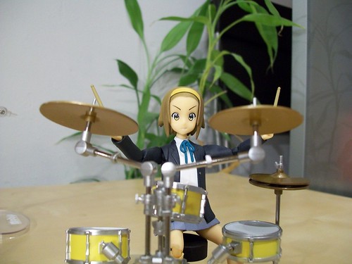 Ritsu behind her drum set