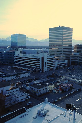 Horizontal lines of the buildings in downtown Anchorage and the Chugach Range from above, the 18th floor of the Captain Cook Hotel, Anchorage, Alaska, USA by Wonderlane