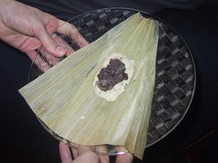 raw tamale, its dough and leaf