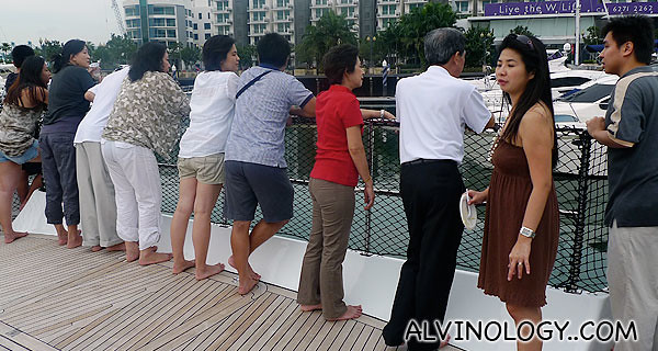 Everyone enjoying the breeze on our way back to Sentosa Cove