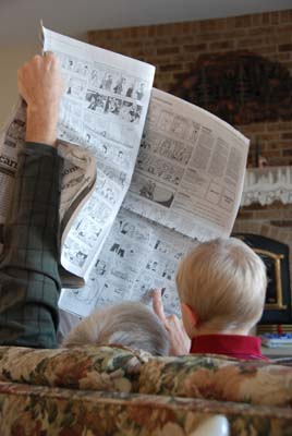 reading the funnies with grandpa