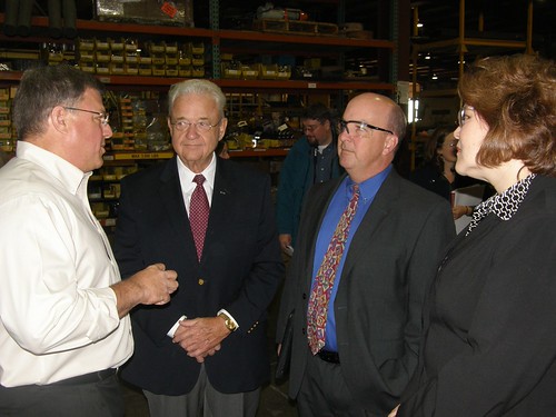 Congressman Leonard Boswell; Judy Canales, USDA Rural Business Programs Administrator; and Bill Menner, USDA Rural Development State Director in Iowa (Next to Canales on Right), listen to Pat Weiler (left) as he talks about upcoming changes at Weiler's manufacturing facility.