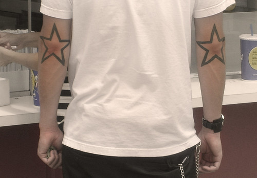 Star Tattoos on elbows (A little help)