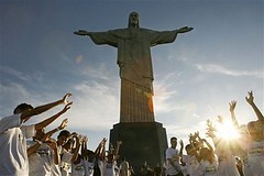 Children rise their hands as they attend a ceremony to promote and support the candidature of the Christ the Redeemer statue to the New Seven Wonders of the World in Rio de Janeiro in this Wednesday, May 2, 2007 file photo.  Christ the Redeemer was select