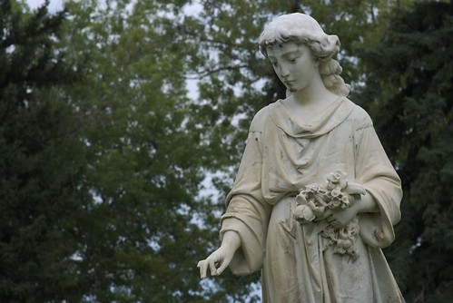 I sometimes see statues in cemeteries where a female figure or angel is 